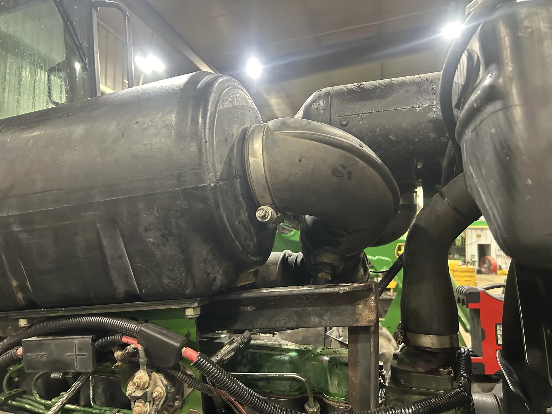 3D-printed air-filter adapter installed on a John Deere tractor