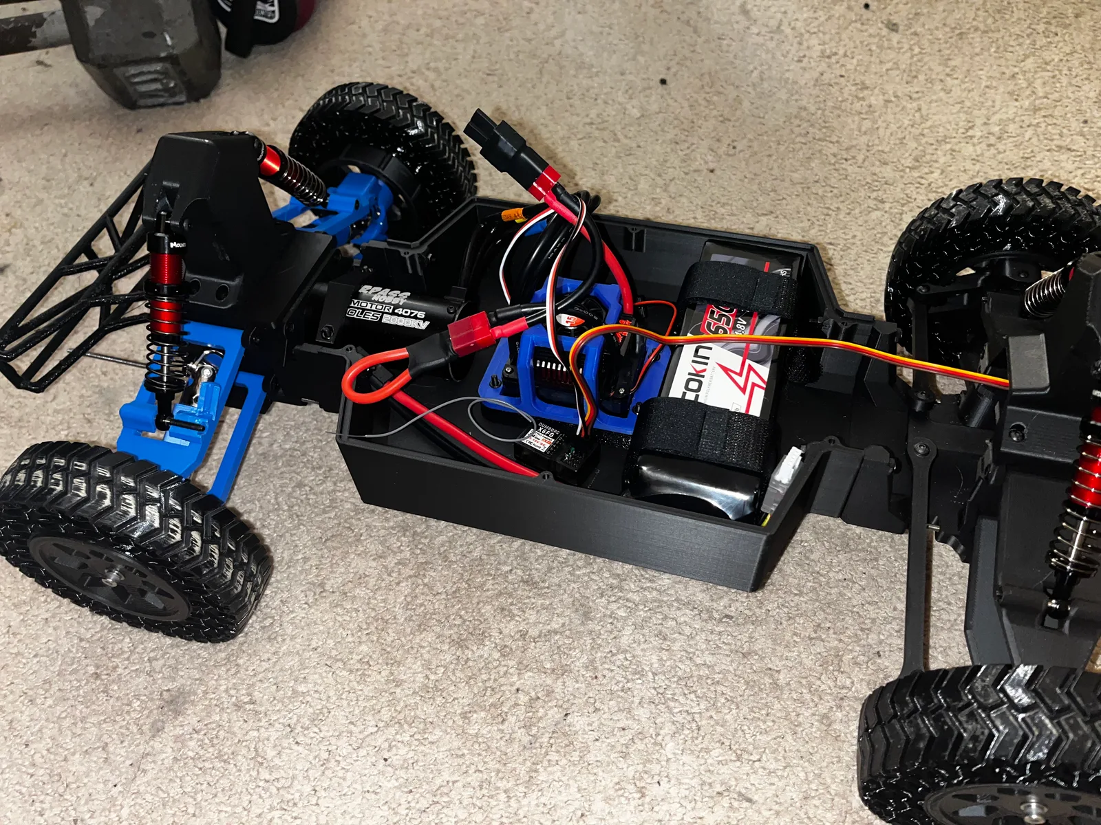 RC car suspension with a broken printed wishbone after testing